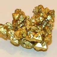 Gold inches up after Fed officials' comments on stimulus